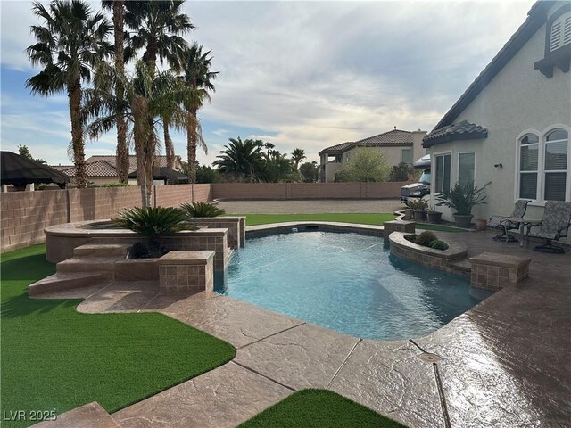 view of pool featuring a patio area and a fenced backyard