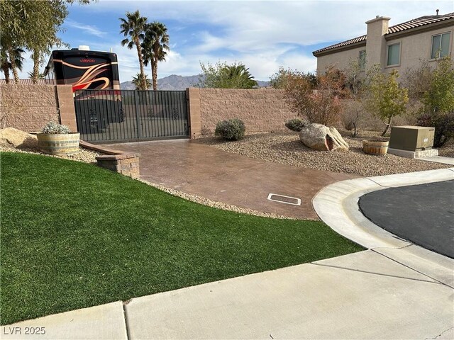 view of yard with a gate and fence