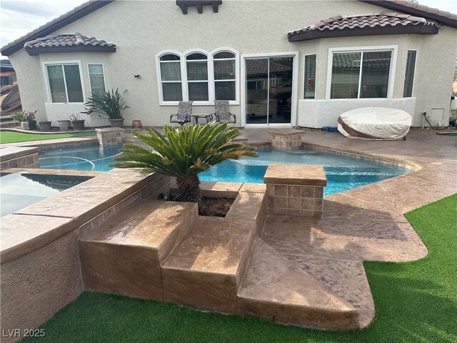 pool featuring a hot tub