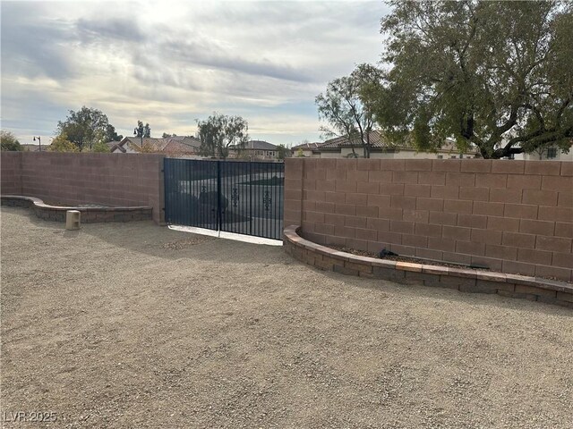 view of yard with a gate and fence private yard