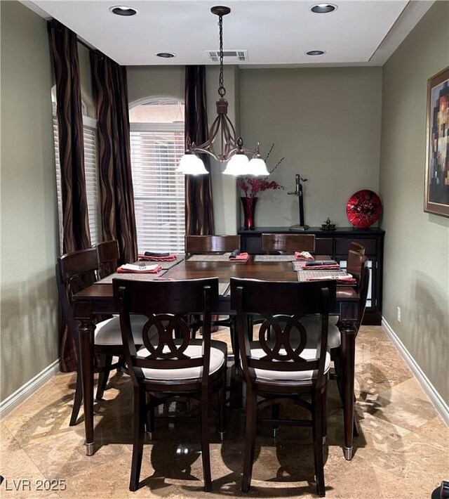 dining space featuring visible vents and baseboards