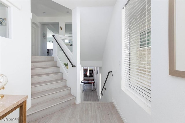 stairway featuring wood finished floors