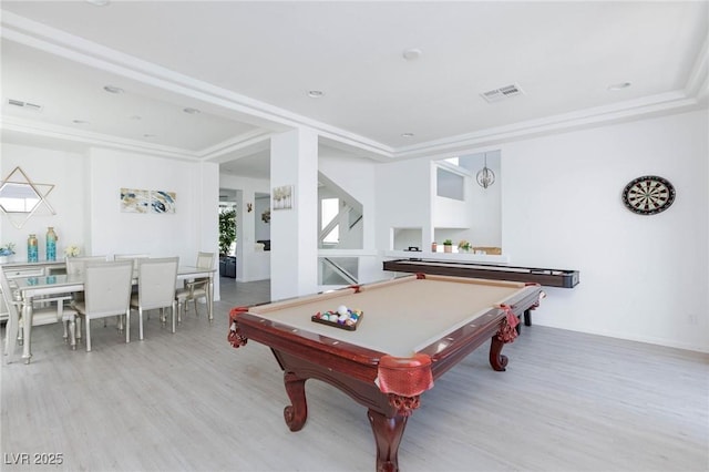 game room featuring light wood-style floors, visible vents, ornamental molding, and billiards