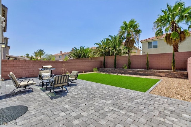 view of patio with an outdoor hangout area and a fenced backyard