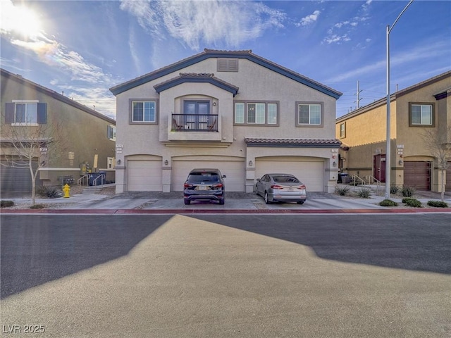 view of front facade with an attached garage and stucco siding