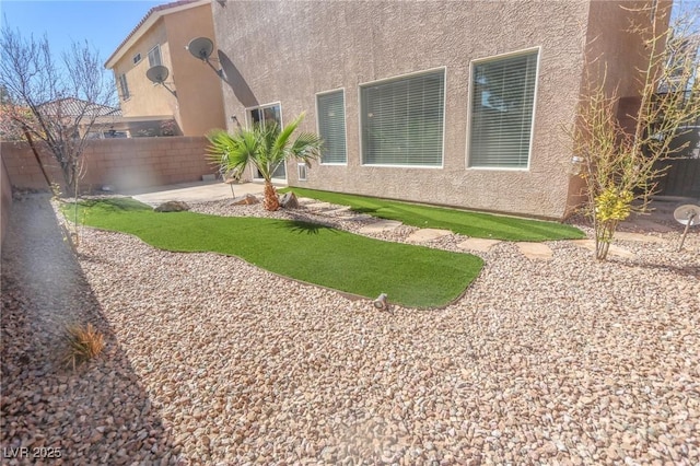 view of yard featuring a patio and a fenced backyard