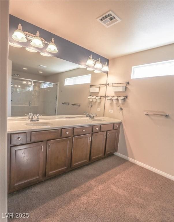 bathroom with carpet floors, a sink, visible vents, and a shower stall