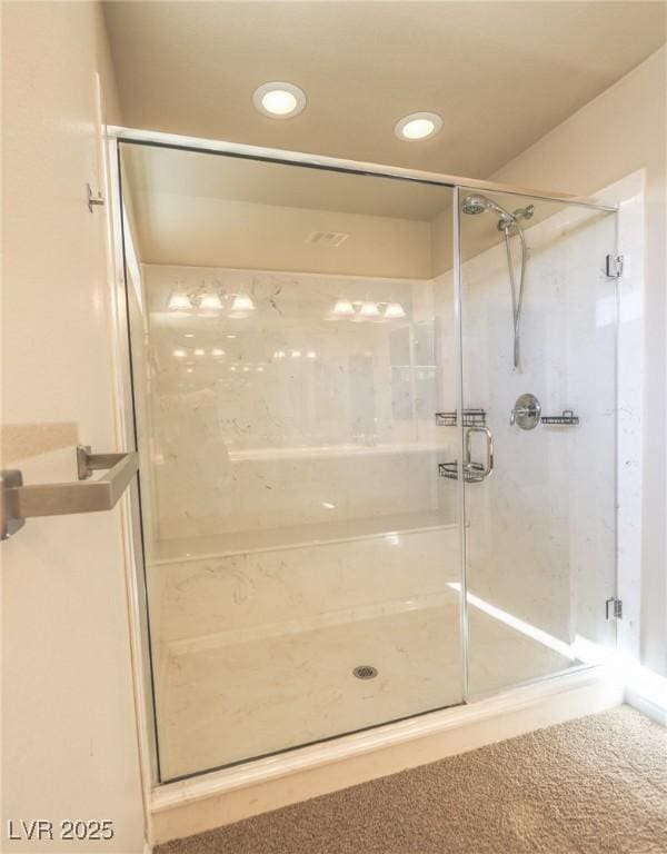 full bath with a stall shower and recessed lighting