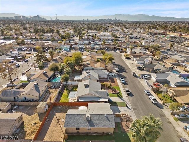 bird's eye view with a residential view and a mountain view