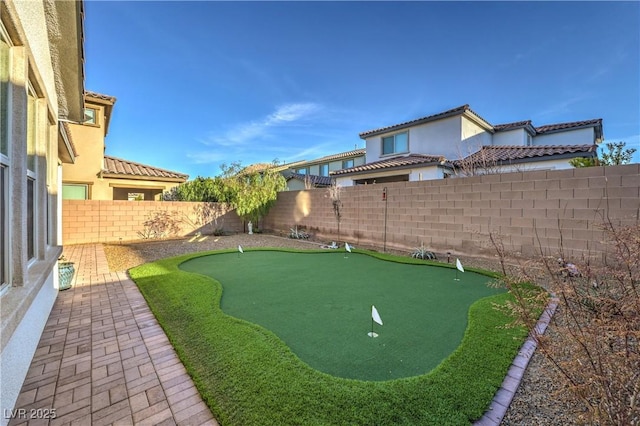 view of yard with a patio area and a fenced backyard