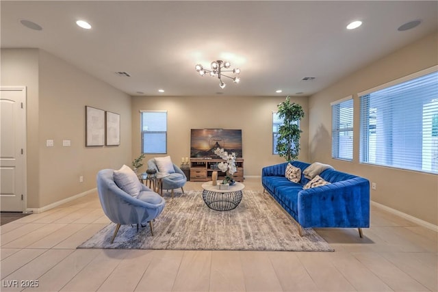 living room with baseboards, visible vents, and recessed lighting