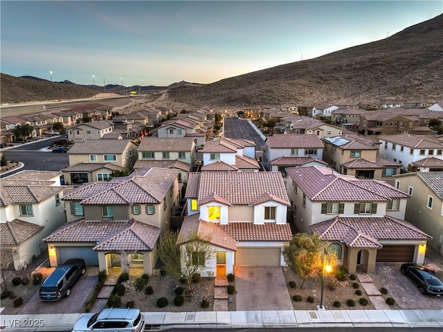drone / aerial view featuring a mountain view and a residential view