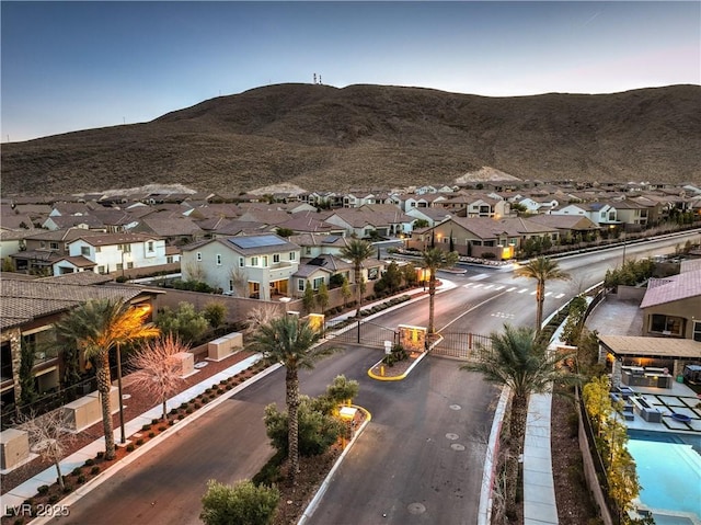 drone / aerial view featuring a mountain view and a residential view