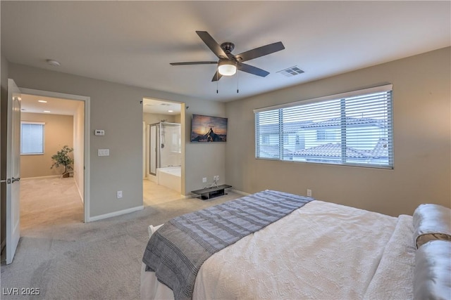 bedroom featuring a ceiling fan, ensuite bathroom, light carpet, baseboards, and visible vents