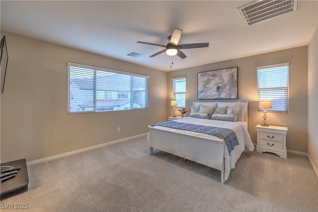 bedroom featuring baseboards, carpet flooring, and visible vents