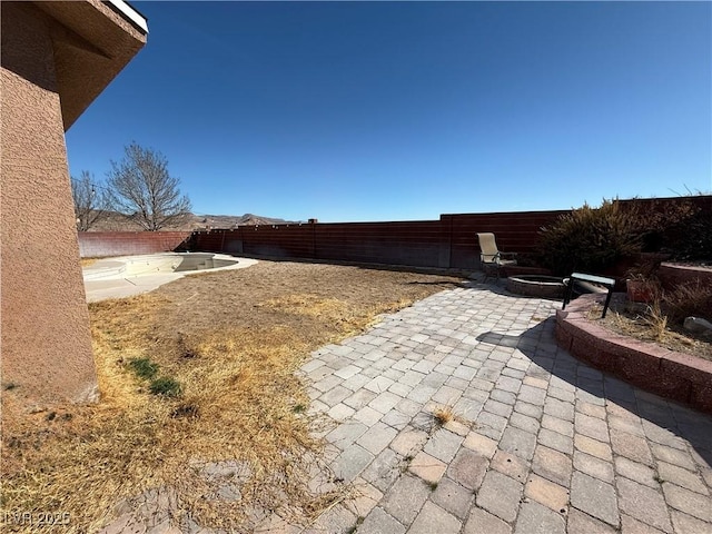 view of yard with a patio and a fenced backyard