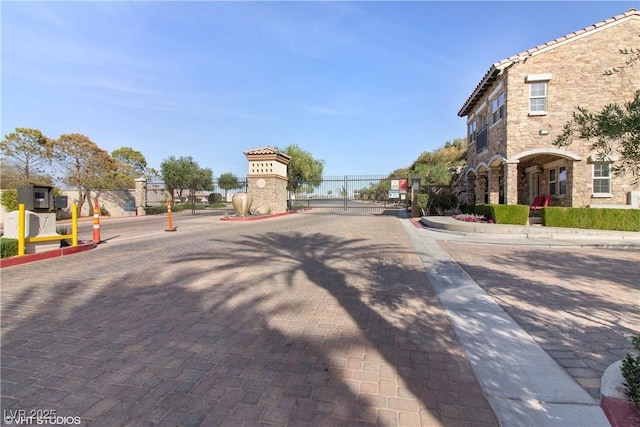 21 Via Visione Unit 201, Henderson, NV 89011 - view of decorative road featuring a gate, a gated entry, and curbs