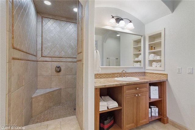 21 Via Visione Unit 201, Henderson, NV 89011 - bathroom with vanity, tiled shower, built in features, tile patterned floors, and baseboards