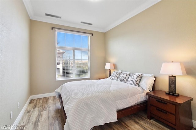 21 Via Visione Unit 201, Henderson, NV 89011 - bedroom with ornamental molding, wood finished floors, and baseboards