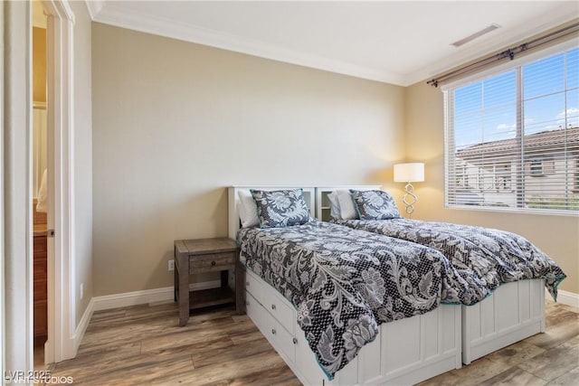 21 Via Visione Unit 201, Henderson, NV 89011 - bedroom with ornamental molding, light wood finished floors, baseboards, and multiple windows