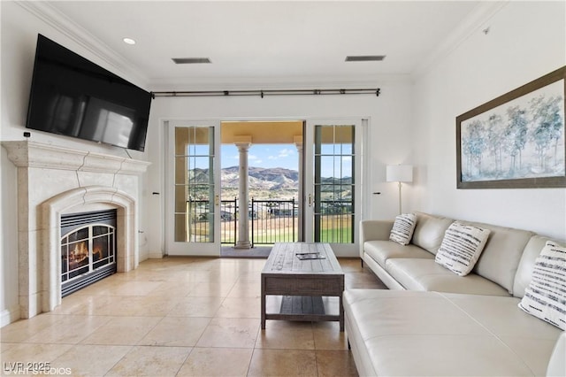 21 Via Visione Unit 201, Henderson, NV 89011 - living area with crown molding, light tile patterned flooring, and a high end fireplace