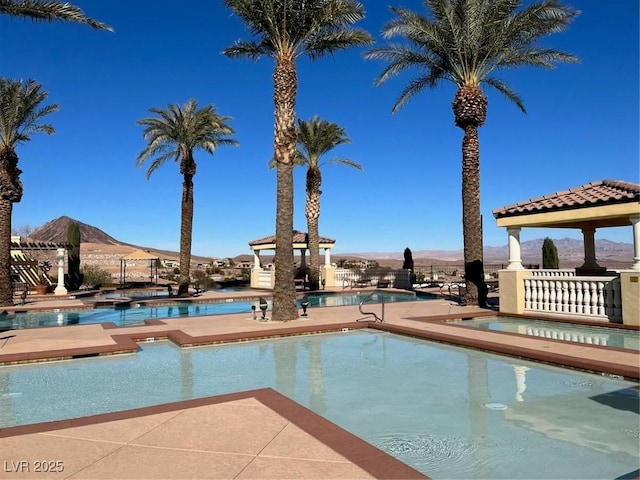 21 Via Visione Unit 201, Henderson, NV 89011 - community pool featuring a gazebo, a mountain view, and a patio