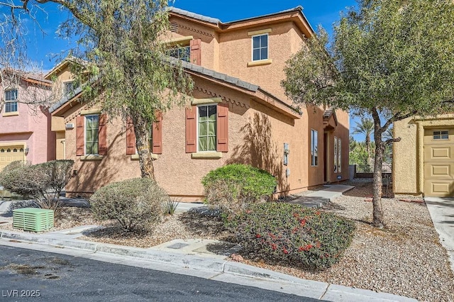 view of property exterior with a tile roof and stucco siding