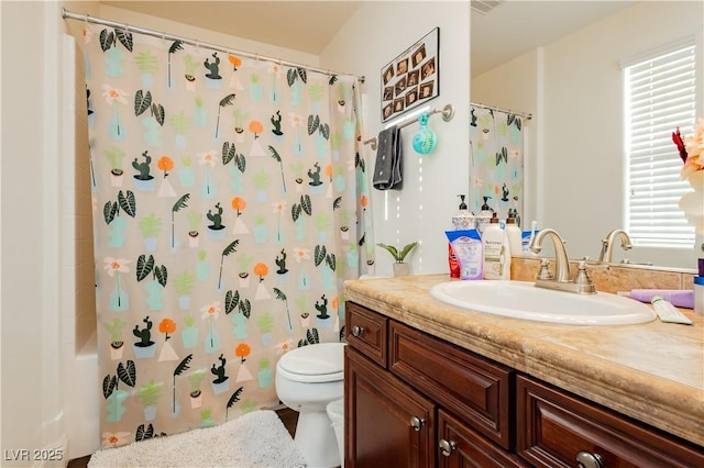 bathroom featuring toilet and vanity