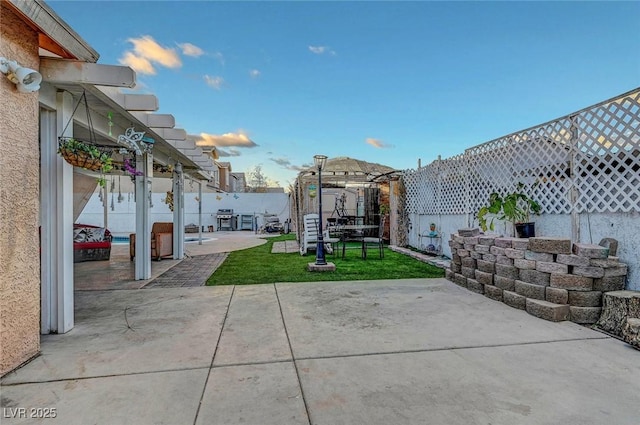 view of patio featuring fence and a pergola