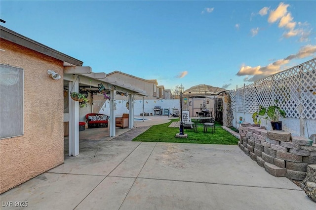 view of patio featuring fence