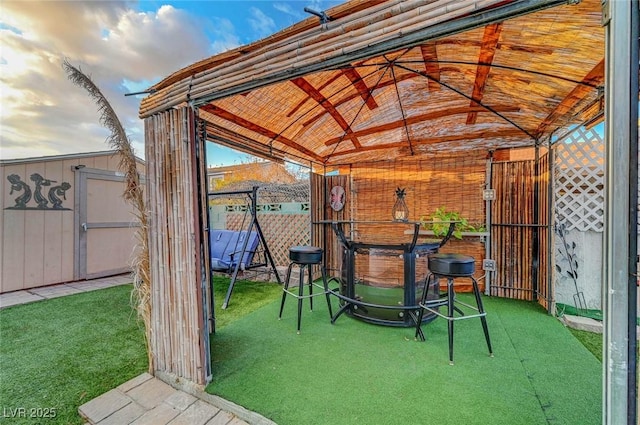 view of patio / terrace featuring fence