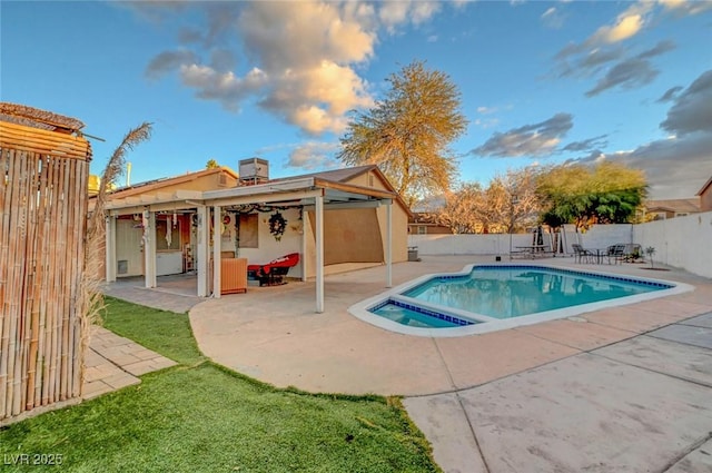 view of pool with a fenced in pool, a fenced backyard, a patio, and an in ground hot tub