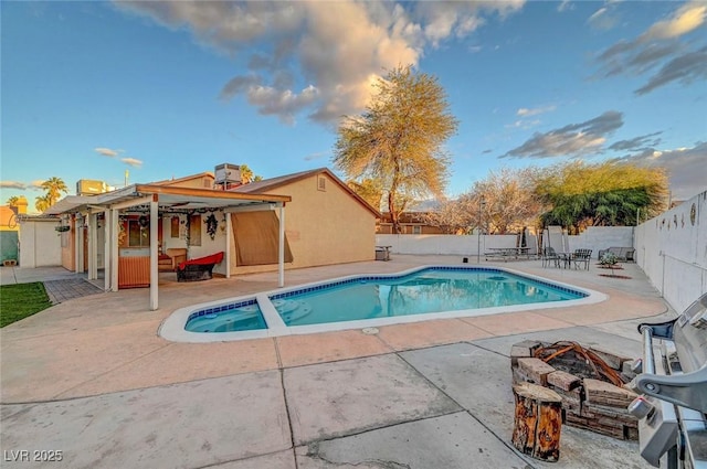 view of swimming pool featuring a fenced in pool, a patio area, and a fenced backyard