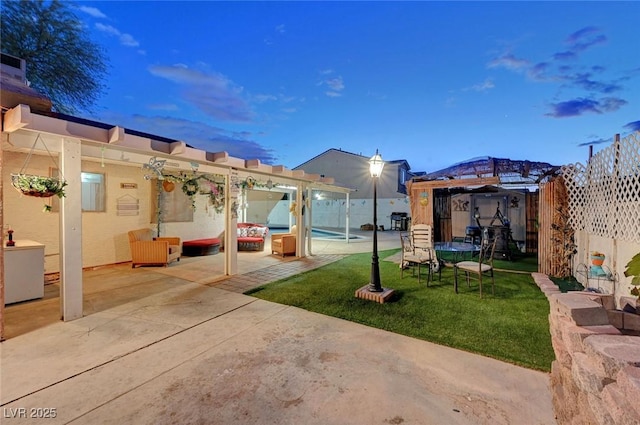 view of yard featuring a trampoline and a patio area