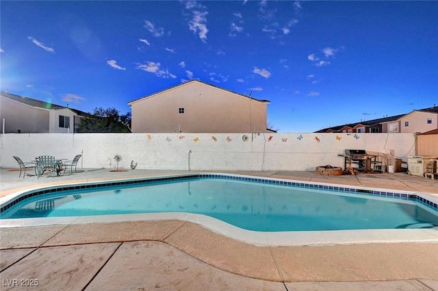 view of swimming pool with a patio area, a fenced backyard, and a fenced in pool