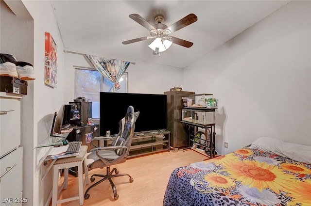 bedroom with ceiling fan and wood finished floors