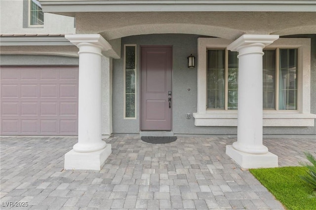 property entrance with a garage