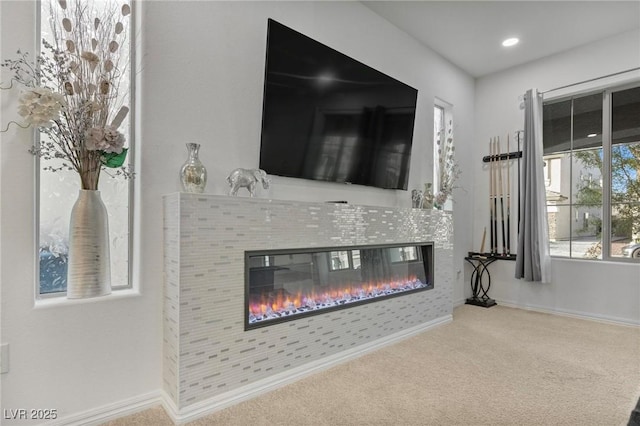 details featuring recessed lighting, carpet, baseboards, and a tile fireplace