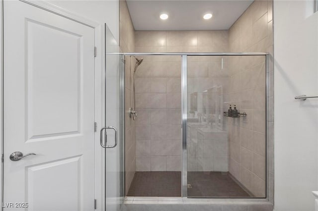 full bathroom with a stall shower and recessed lighting