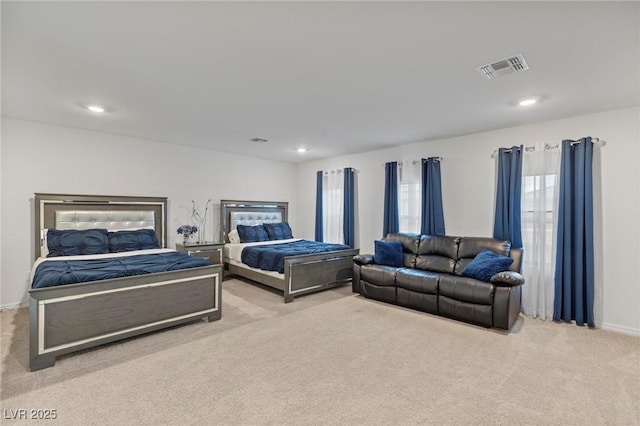 bedroom with recessed lighting, visible vents, and light colored carpet