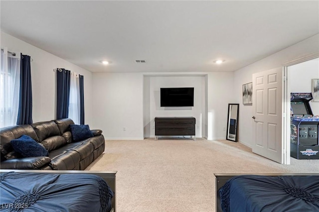 living area with carpet floors, visible vents, baseboards, and recessed lighting