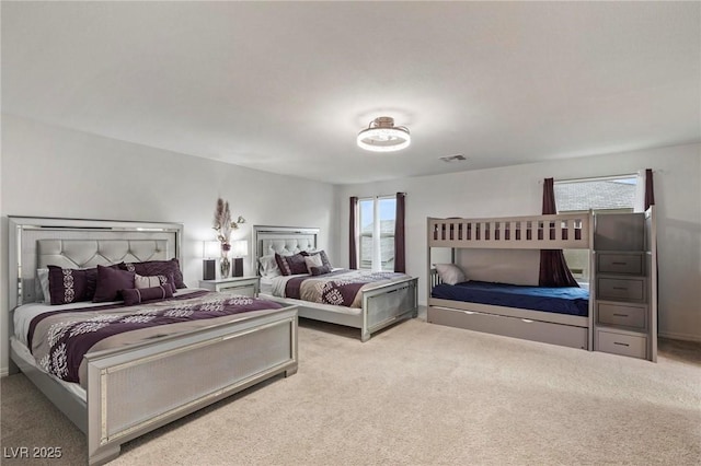 bedroom with light colored carpet and visible vents