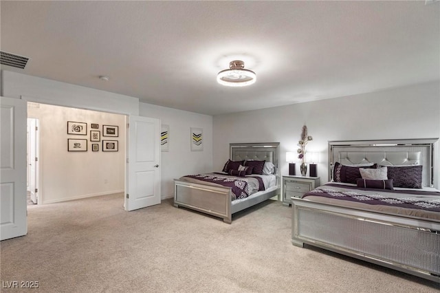 bedroom featuring baseboards, visible vents, and light colored carpet