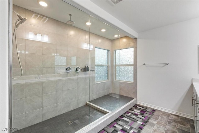 full bathroom with recessed lighting, visible vents, baseboards, and tiled shower