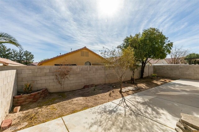 exterior space with a fenced backyard