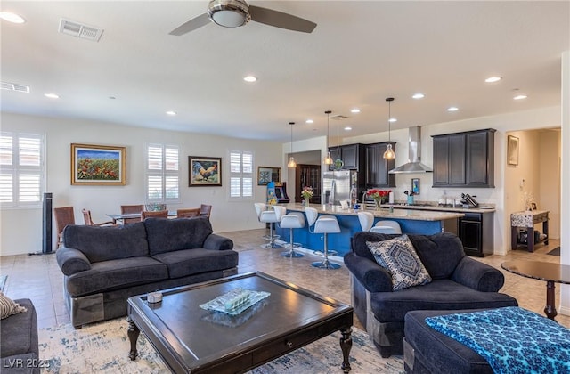 living room featuring recessed lighting, visible vents, and light tile patterned flooring