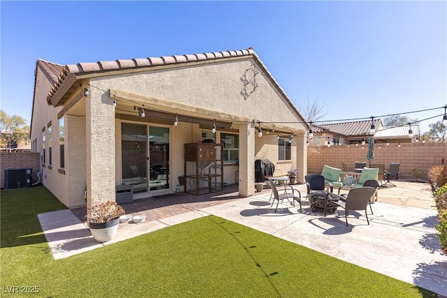 back of house with a patio area, fence, central AC, and stucco siding