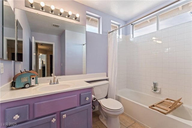 bathroom with visible vents, toilet, shower / bath combo, vanity, and tile patterned floors