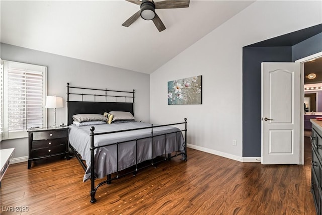 bedroom featuring lofted ceiling, dark wood-style flooring, and baseboards