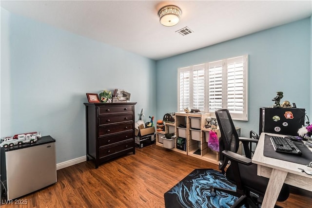 office space featuring dark wood-style floors, baseboards, and visible vents